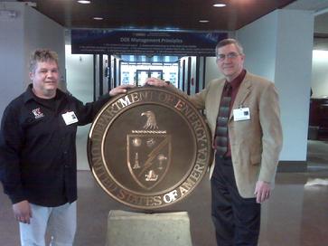 Doug Pelmear and Henry County Commissioner Myers at US DOE HP2g 110mpg V8 Hybrid Electric fuel economy